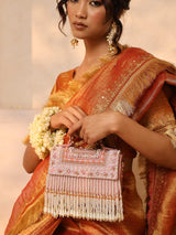 Pink Kiara flap-over bag with handle from The Tan Clan, featuring a stylish design and spacious interior.