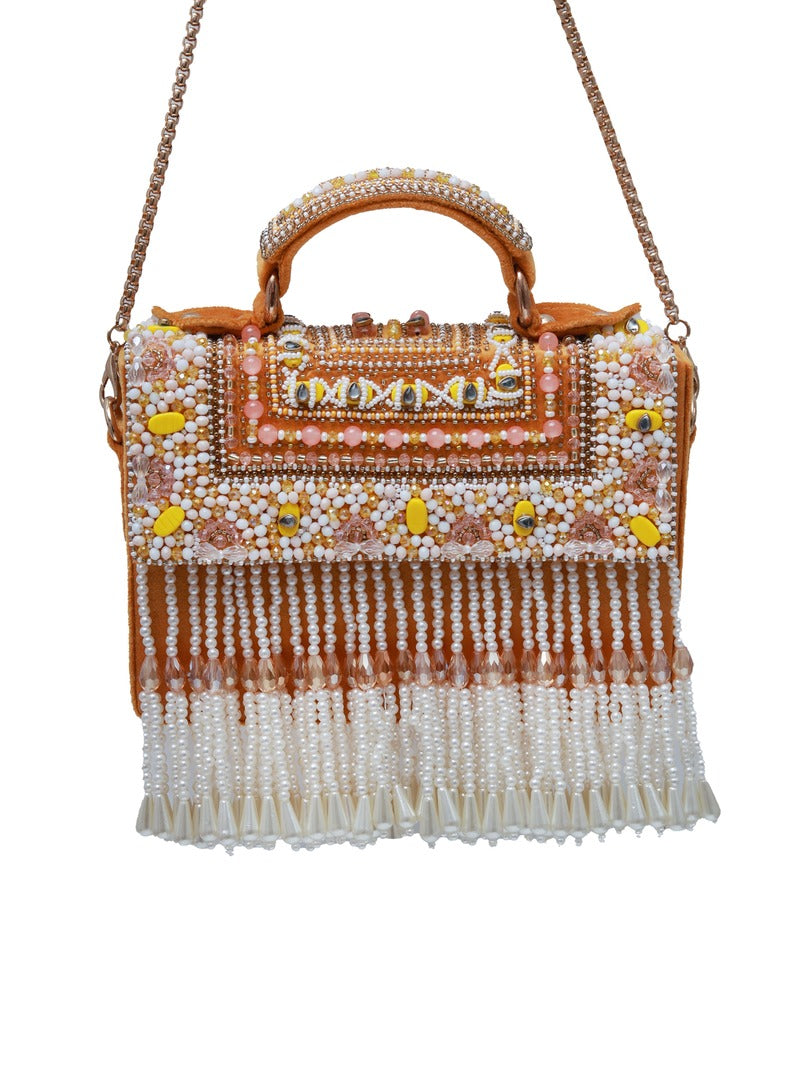 Yellow flap-over bag with handle from The Tan Clan, featuring a stylish design and spacious interior.