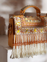 Yellow flap-over bag with handle from The Tan Clan, featuring a stylish and spacious design for everyday use.