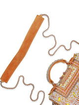 Yellow flap-over bag by The Tan Clan with a handle, featuring a stylish design and spacious interior.