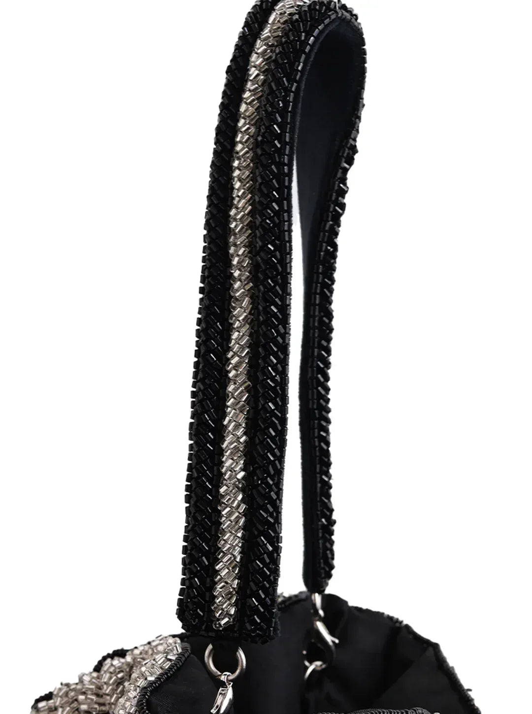 Aarna black potli bag from The Tan Clan featuring traditional drawstring closure and decorative embellishments.