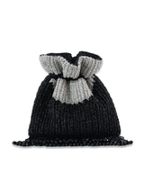 Aarna black potli bag from The Tan Clan featuring traditional drawstring closure and decorative embellishments.