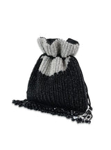Aarna black potli bag from The Tan Clan featuring traditional drawstring closure and intricate detailing.