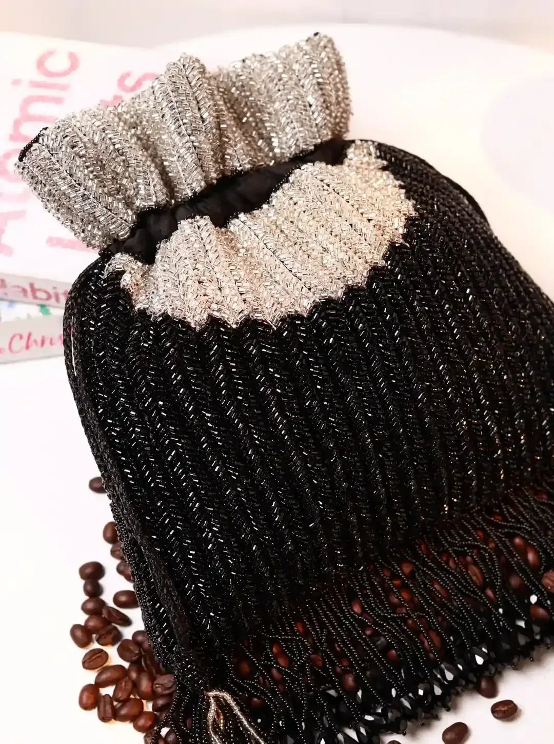 Aarna Black Potli Bag from The Tan Clan, elegant traditional purse with intricate embroidery and a drawstring closure.