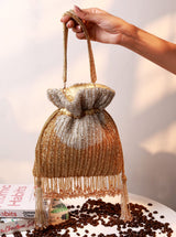 Aarna Gold Potli Bag from The Tan Clan, traditional embellished potli bag with gold fabric and decorative drawstring closure.