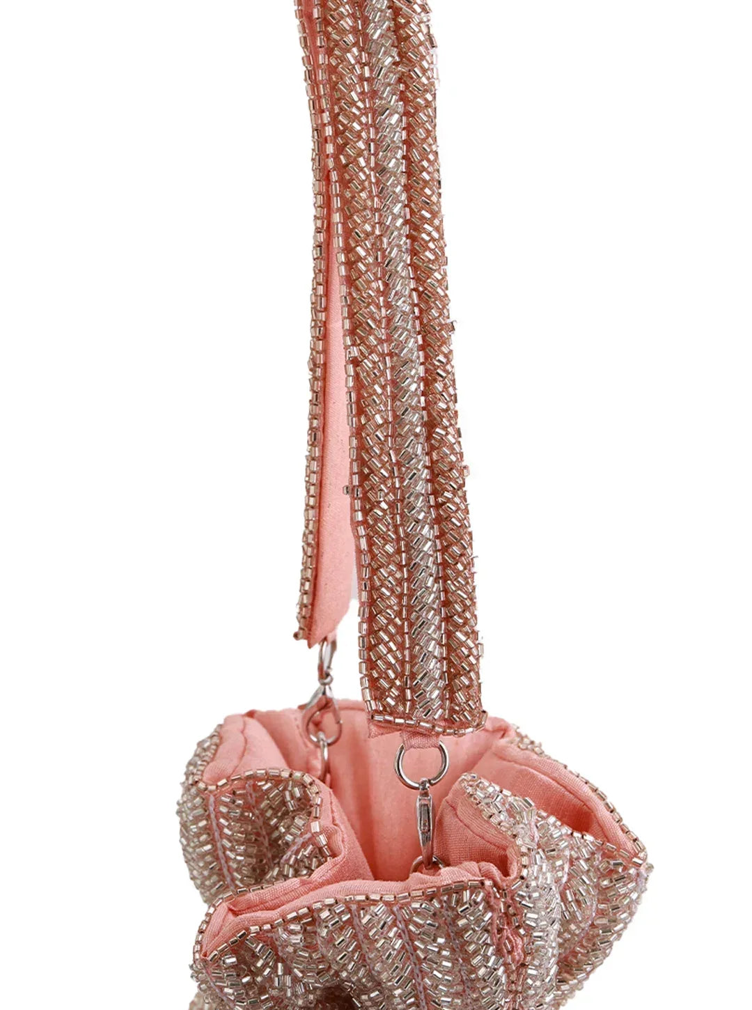 Pink Aarna Potli Bag by The Tan Clan featuring traditional embroidery and drawstring closure, perfect for special occasions.