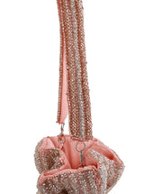 Pink Aarna Potli Bag by The Tan Clan featuring traditional embroidery and drawstring closure, perfect for special occasions.