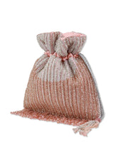 Aarna pink potli bag from The Tan Clan featuring traditional drawstring closure and decorative embellishments.