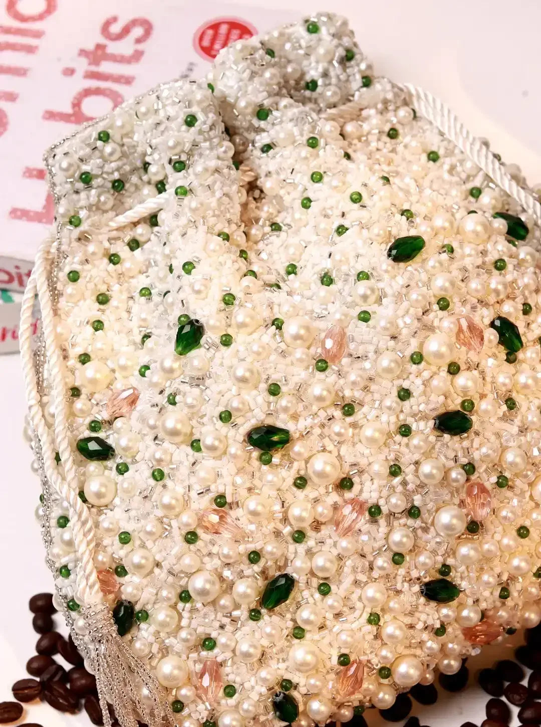 Ayra Pearl Potli Bag by The Tan Clan featuring pearl embellishments and traditional drawstring closure.