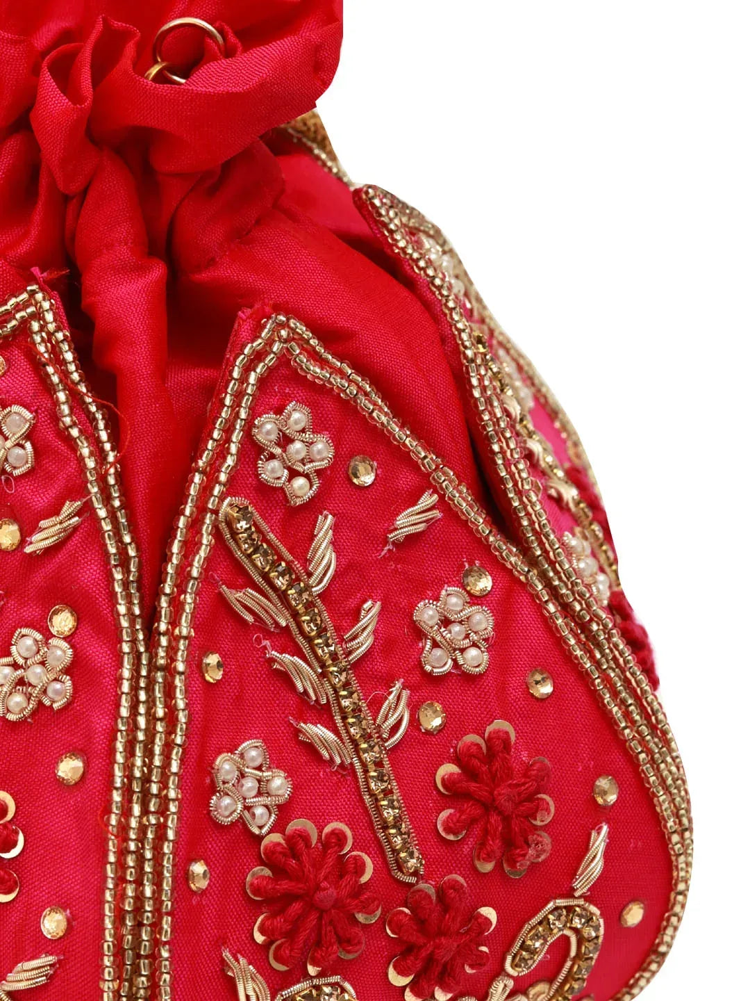 Hot pink Lotus Potli bag from The Tan Clan, elegant traditional Indian Potli bag with intricate design and tassel details.