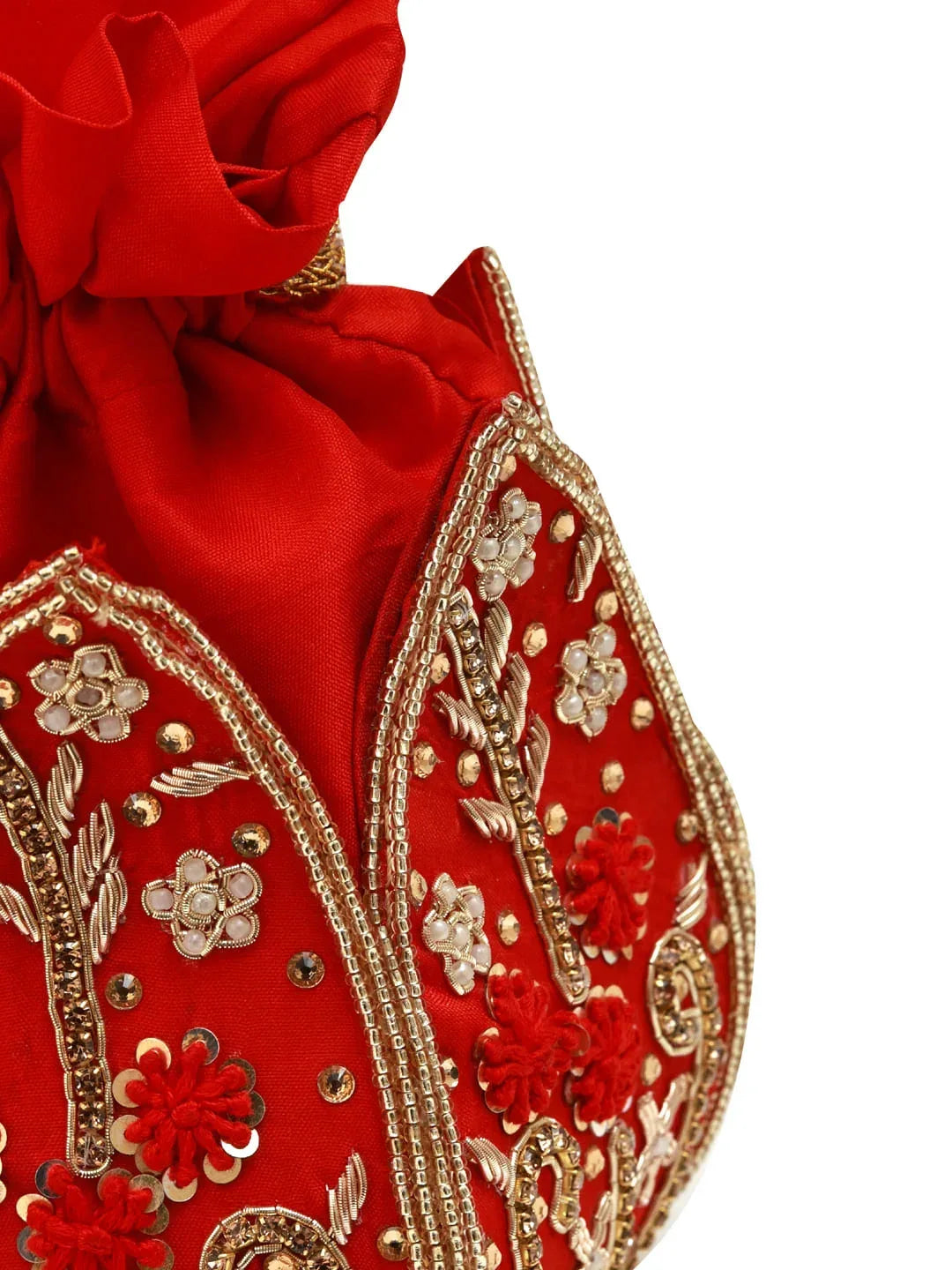 Red lotus-patterned Baag potli bag from The Tan Clan with traditional drawstring closure and decorative tassels.