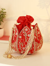 Red lotus design Baag Potli bag by The Tan Clan, traditional Indian accessory with intricate embroidery and vibrant colors.