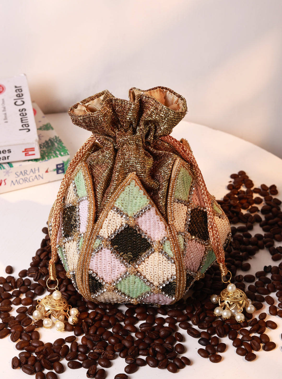 Ketki Lotus Potli bag by The Tan Clan with pearl handle, featuring intricate lotus design and elegant traditional style.