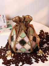 Ketki Lotus Potli bag by The Tan Clan with pearl handle, featuring intricate lotus design and elegant traditional style.