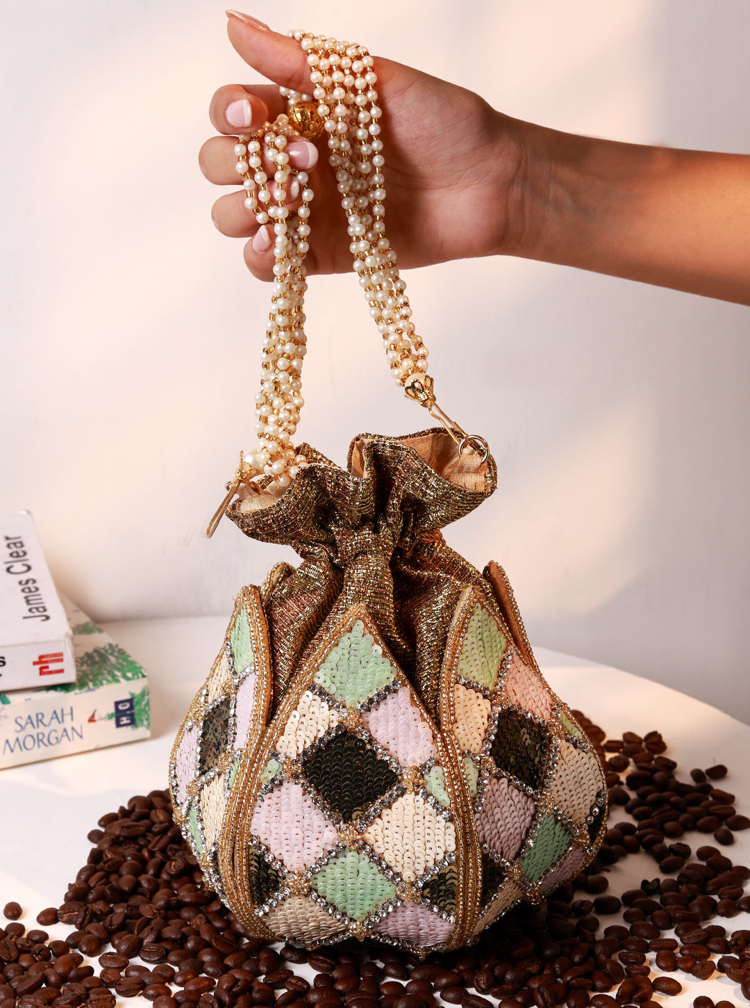 Ketki Lotus Potli bag by The Tan Clan featuring a pearl handle and intricate lotus design, perfect for traditional occasions.