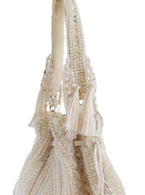 White tasselled Potli bag from The Tan Clan with traditional design and decorative tassels, perfect for festive occasions.