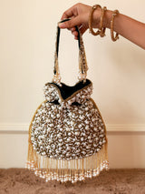 Rimsha Black Pearl Potli Bag with tassels from The Tan Clan, stylish traditional Indian purse with decorative black pearls.