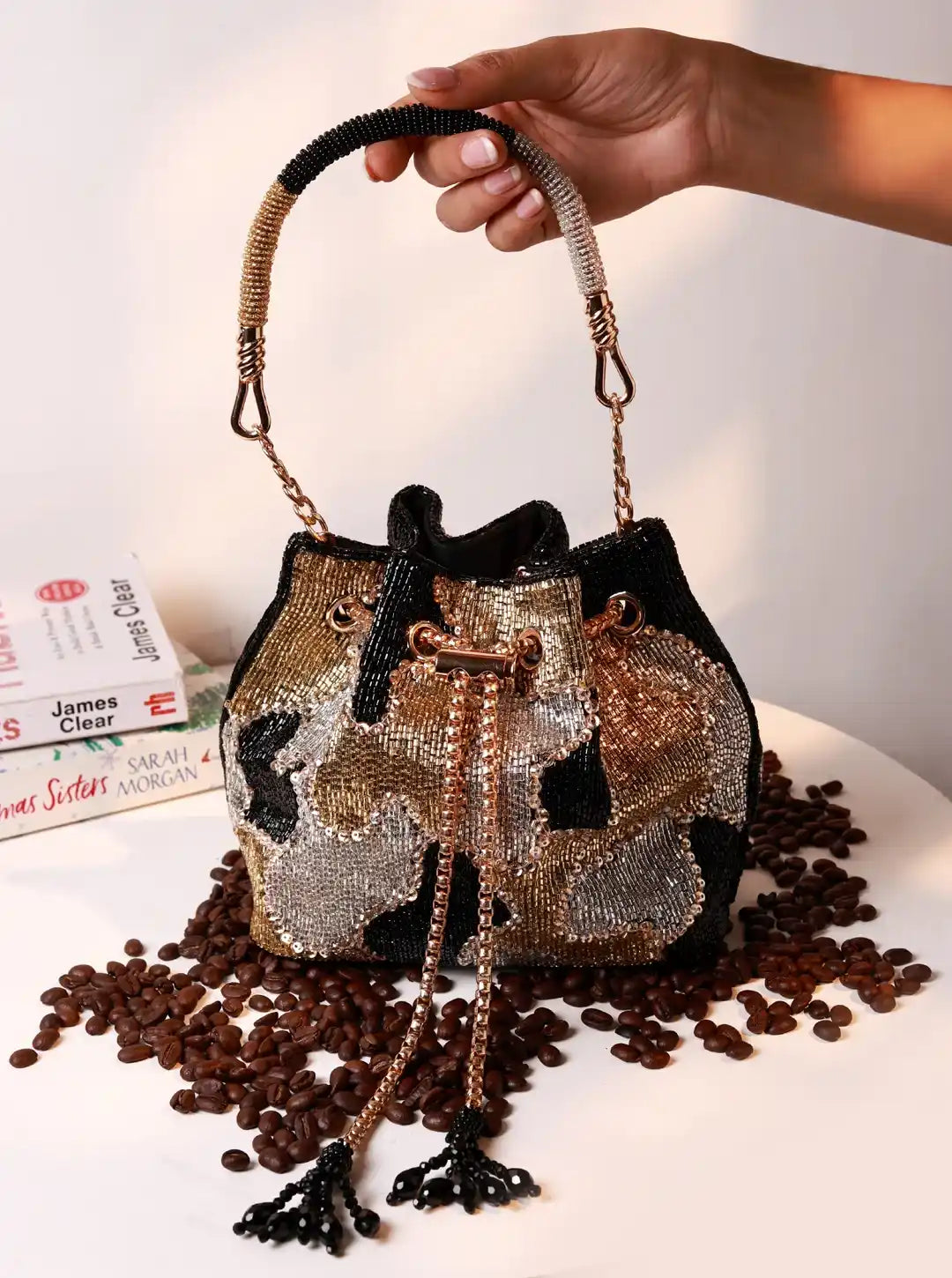Black Terra Bucket Bag from The Tan Clan, stylish potli bag with traditional design and drawstring closure.
