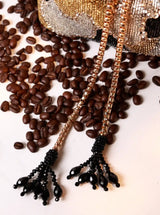 Black Terra Bucket Potli Bag by The Tan Clan with traditional drawstring closure and decorative embellishments.