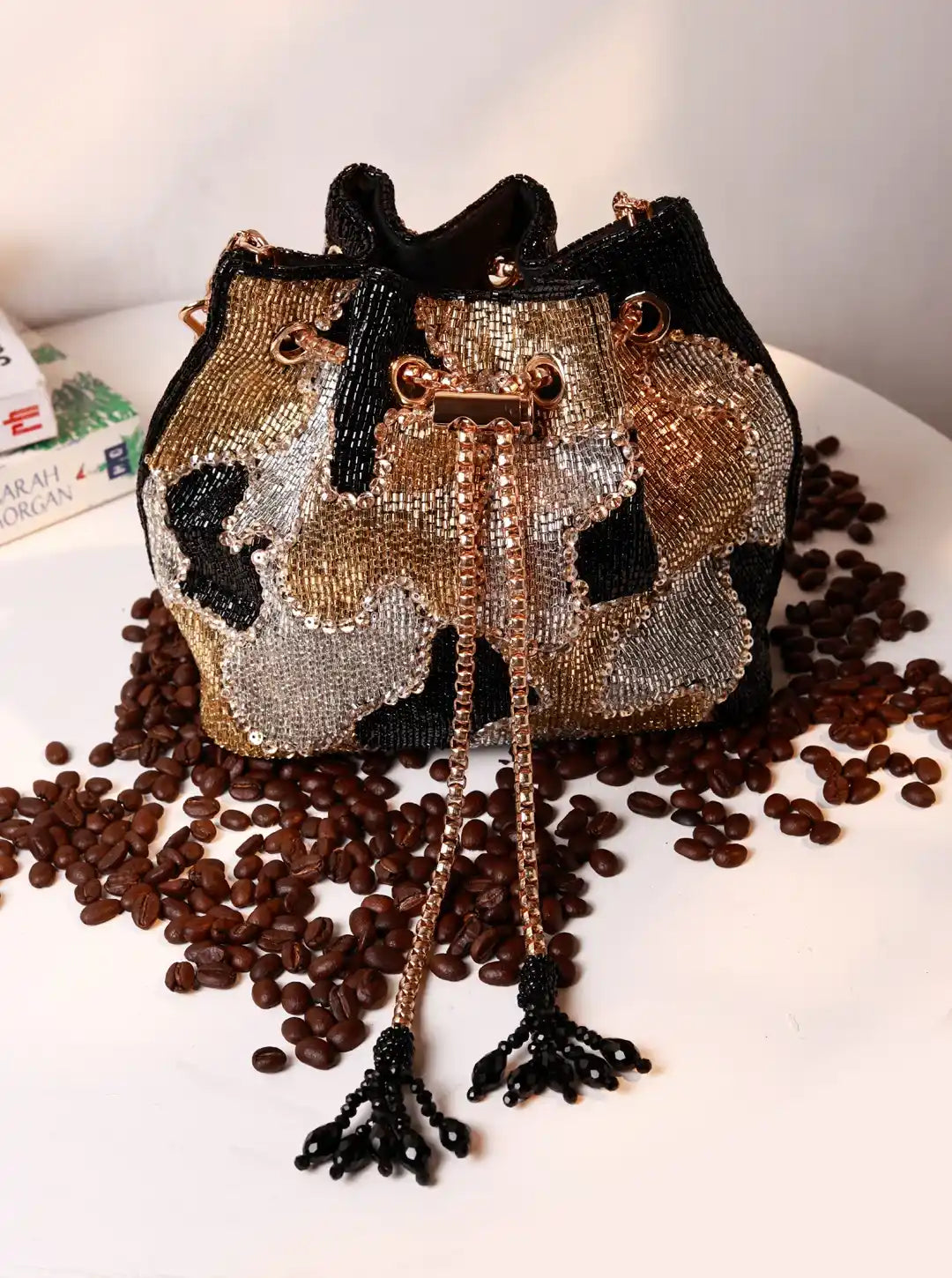 Terra black bucket bag from The Tan Clan, stylish potli bag with a rounded shape and drawstring closure, made of textured fabric.