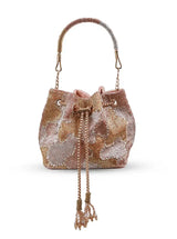 Rose gold Terra bucket bag from The Tan Clan, stylish potli bag with elegant design and drawstring closure.