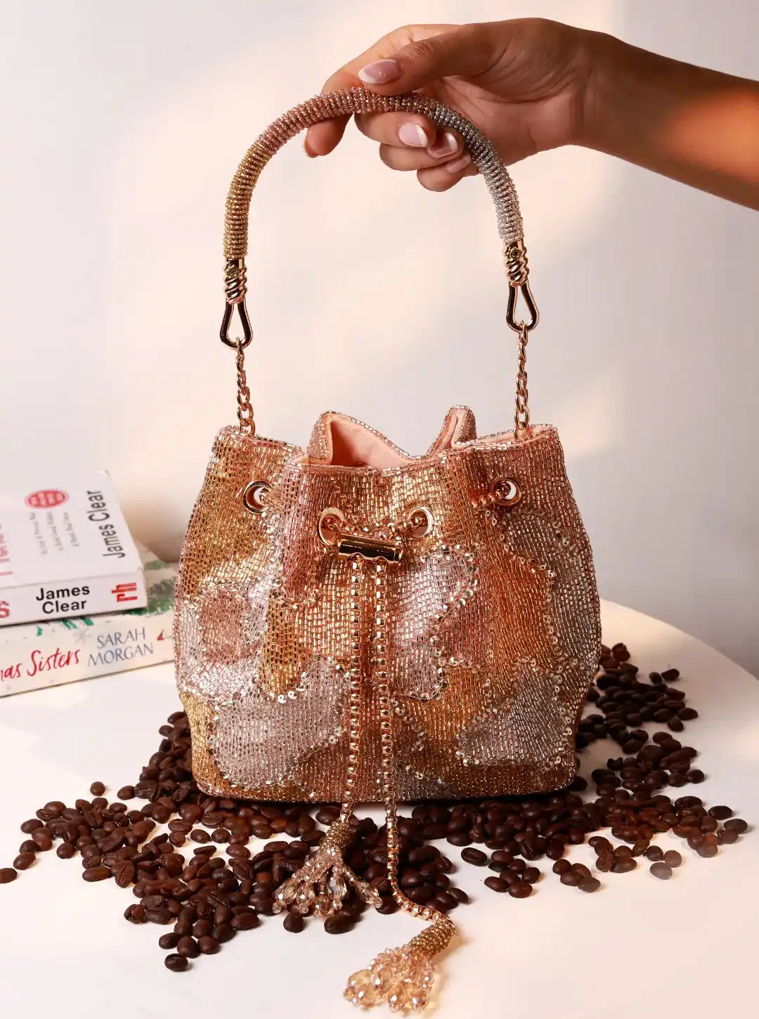 Terra Rose Gold Bucket Bag from The Tan Clan, stylish potli bag with a metallic finish and traditional drawstring closure.
