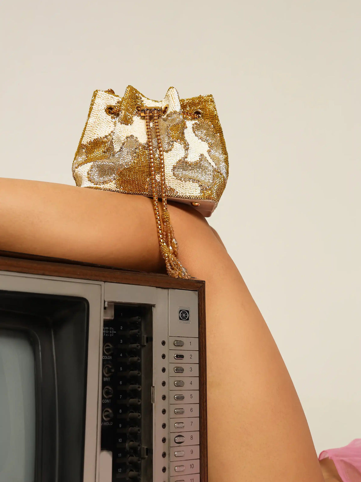 White Terra Bucket Bag by The Tan Clan, stylish potli bag with drawstring closure and decorative embellishments.