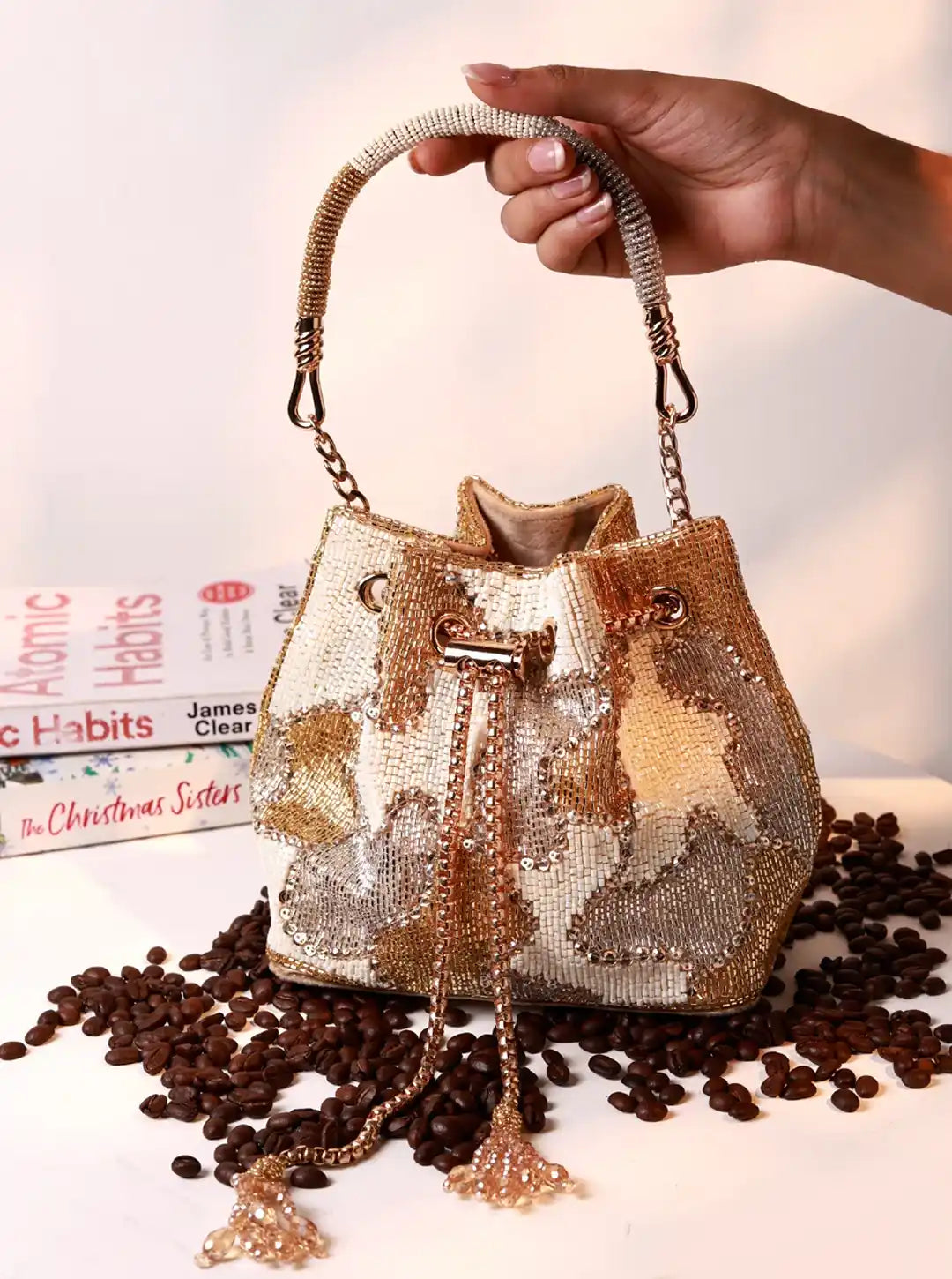 Terracotta white bucket bag by The Tan Clan, stylish potli bag with a rounded shape and traditional drawstring closure.