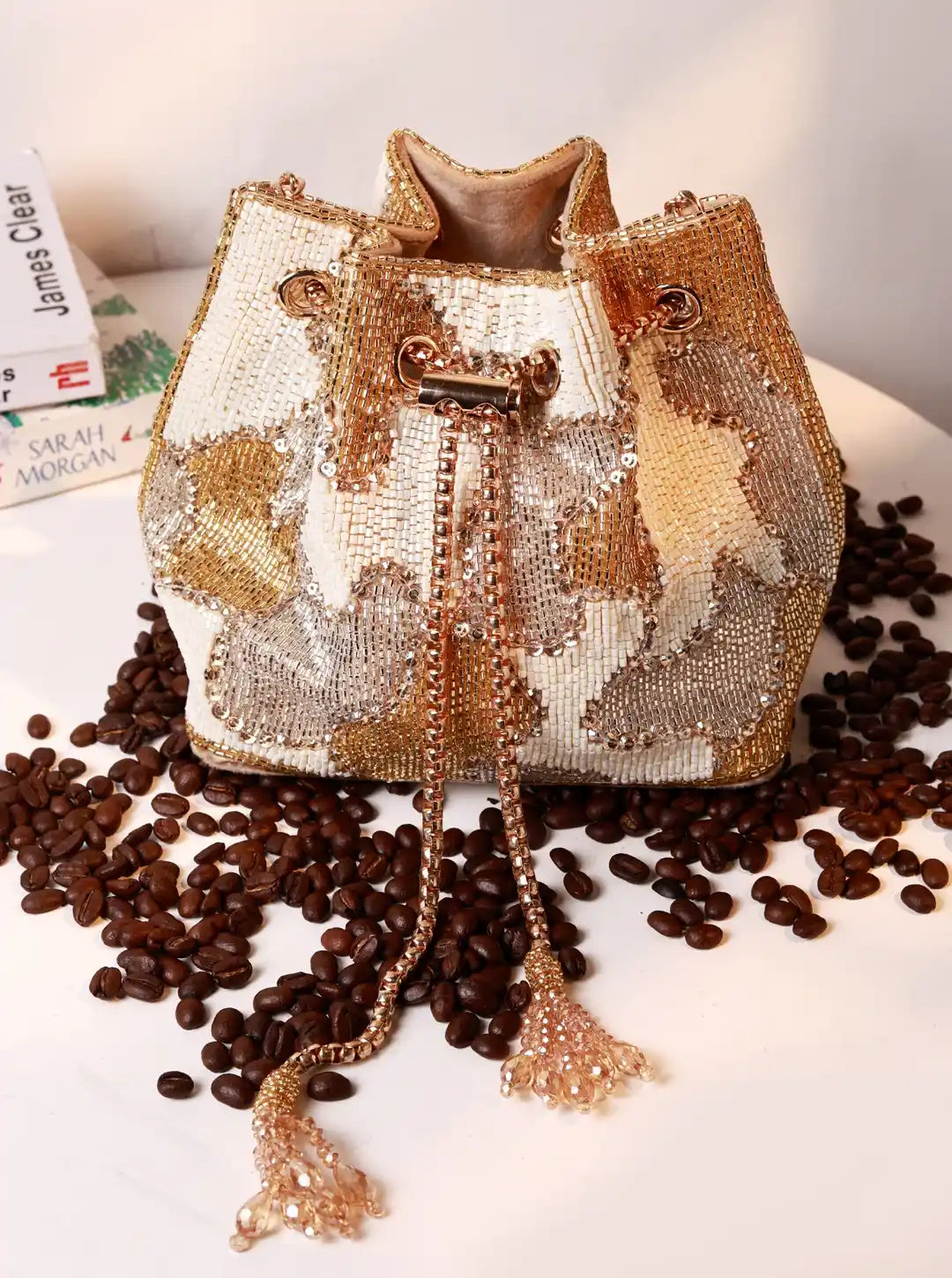 Terra white bucket bag by The Tan Clan, stylish potli bag with rounded shape and handle, perfect for casual and evening wear.