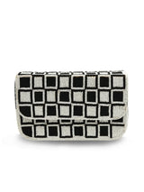 Checkered Blake shoulder bag by The Tan Clan featuring a stylish black and white pattern and adjustable shoulder strap.
