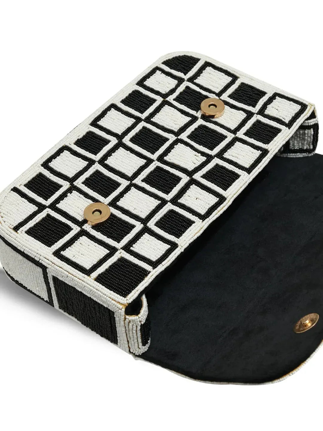 Blake checkered shoulder bag by The Tan Clan featuring a stylish black and white checkered pattern and shoulder strap.