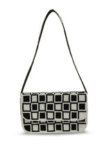 Checkered Blake shoulder bag by The Tan Clan featuring a stylish black and white pattern and a convenient shoulder strap.