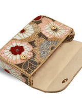 Red floral shoulder bag from The Tan Clan with Daisy Red design, featuring a stylish and spacious shoulder bag for everyday use.