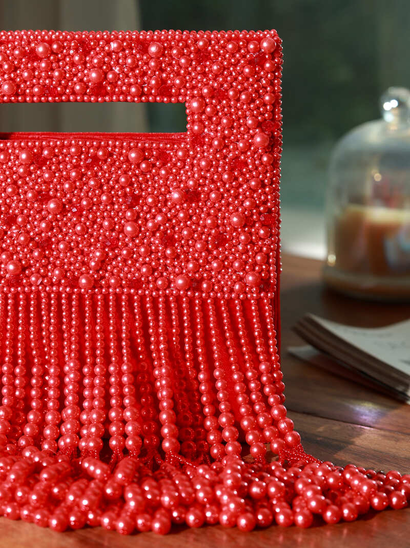 White Ruby Embellished Flap Over Clutch Bag by The Tan Clan with sparkling ruby accents and elegant design.
