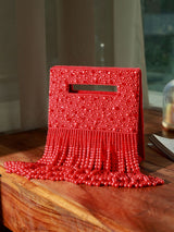 White Ruby Embellished Flap Over Clutch Bag by The Tan Clan, featuring sparkling ruby accents and elegant design.