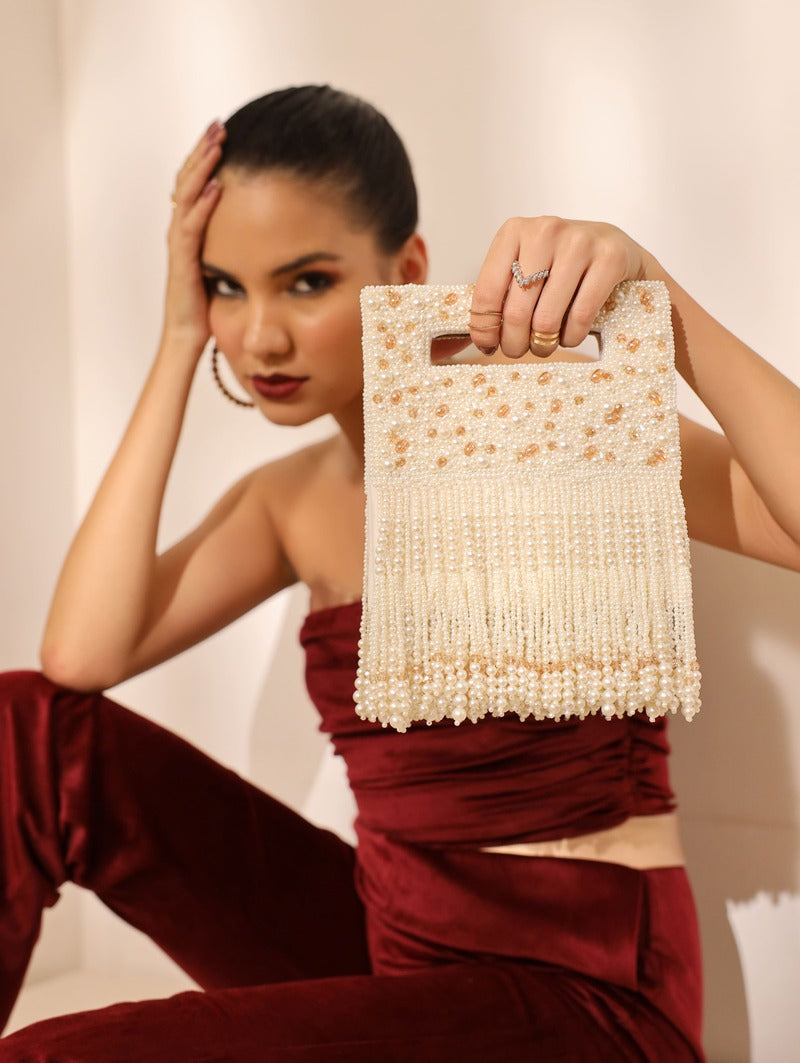 White Ruby Embellished Flap Over Clutch Bag from The Tan Clan with sparkling ruby details and elegant design.