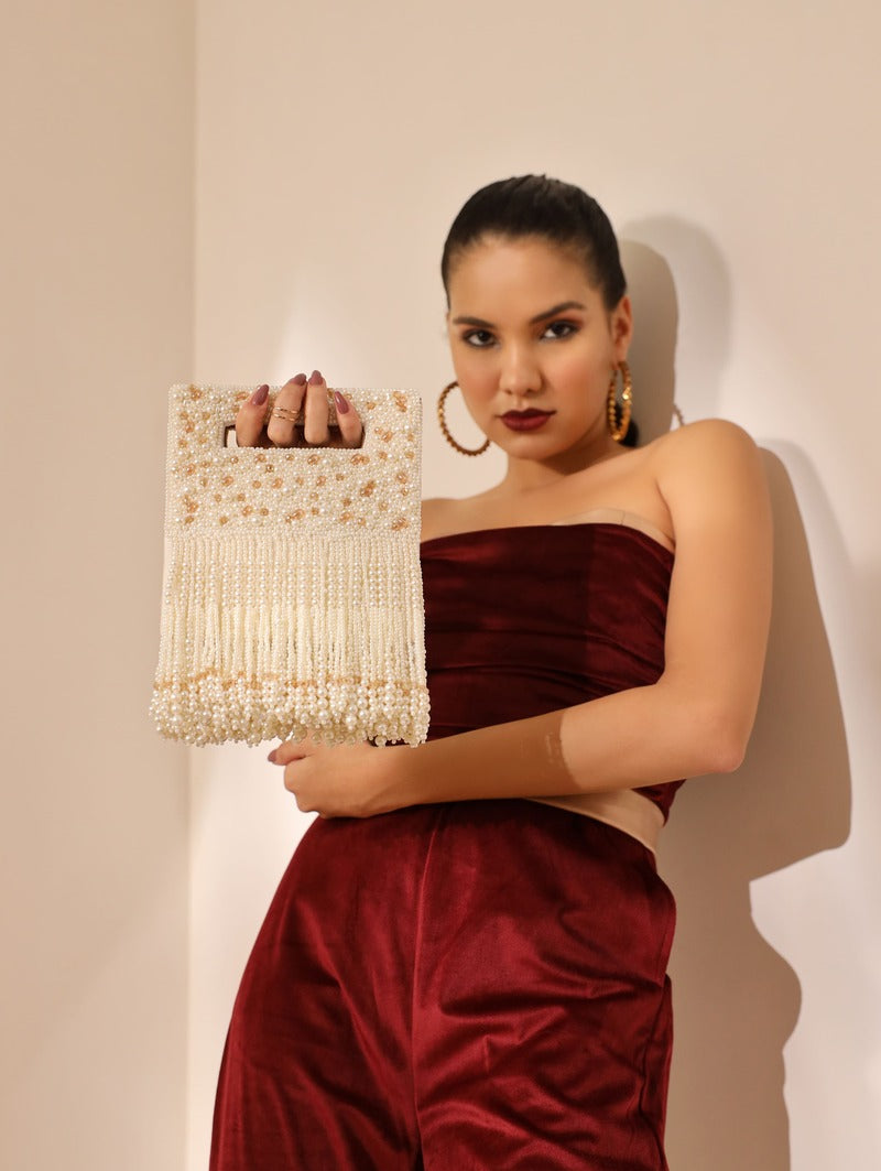 White Ruby Embellished Flap Over Clutch Bag by The Tan Clan with sparkling ruby accents and elegant design.