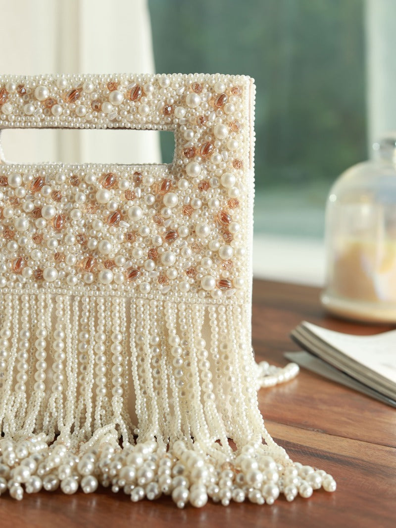 White Ruby Embellished Flap Over Clutch Bag by The Tan Clan with sparkling gemstone accents and elegant design.