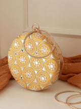 White round clutch purse from The Tan Clan's Inaara collection, featuring a sleek and stylish design with a smooth finish.